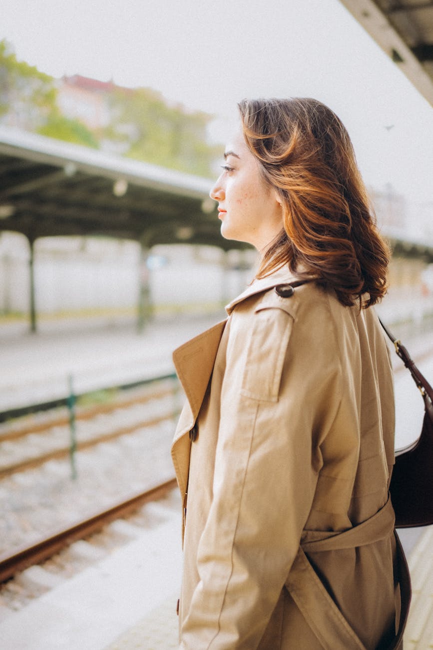 woman waiting at train station platform